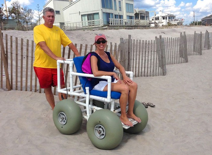 picture of woman using a beach access chair