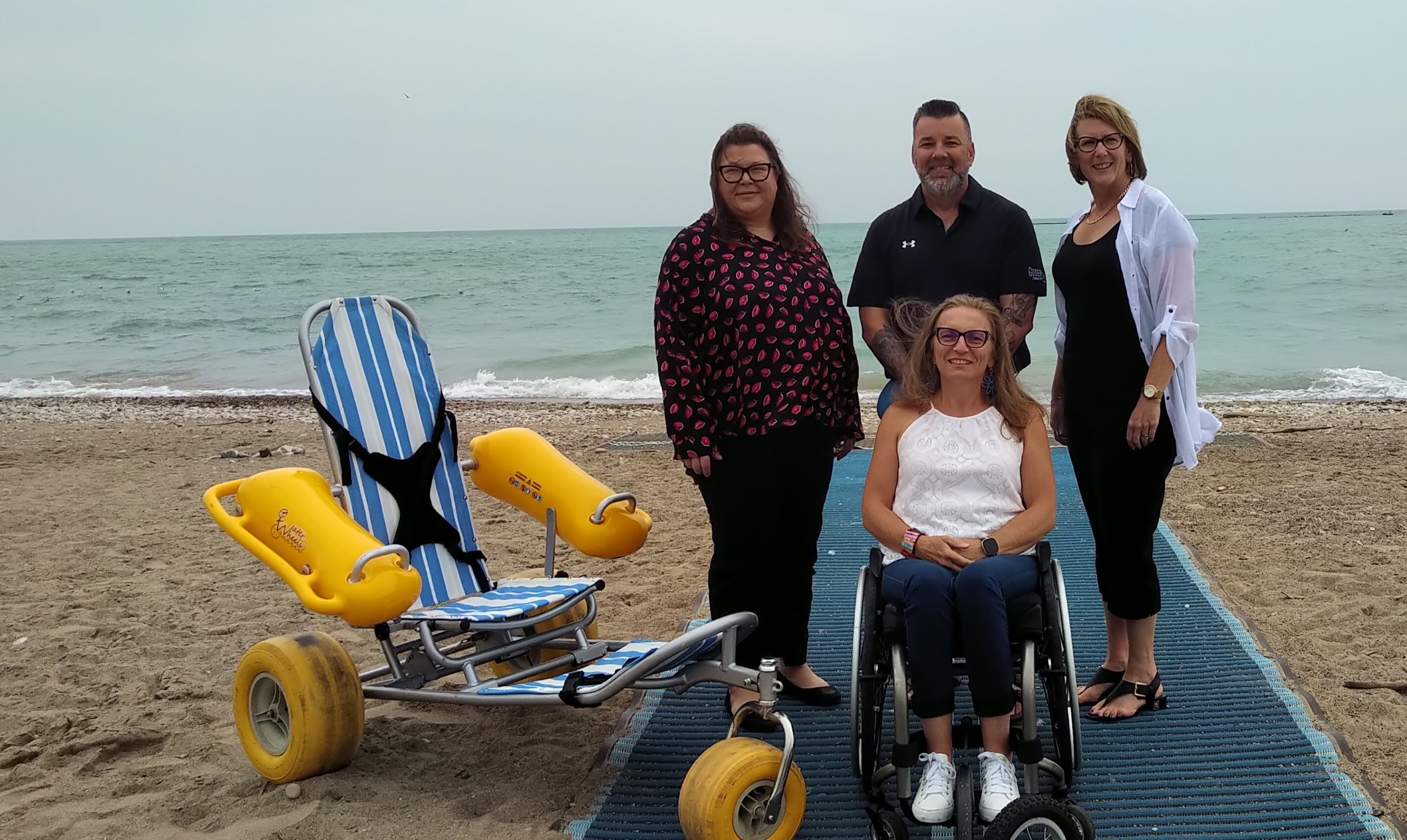 Picture of Julie Sawchuk and Mobi-Chair Floating Wheelchair with Town Staff